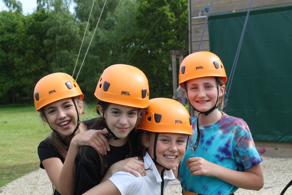students in rock climbing safety gear