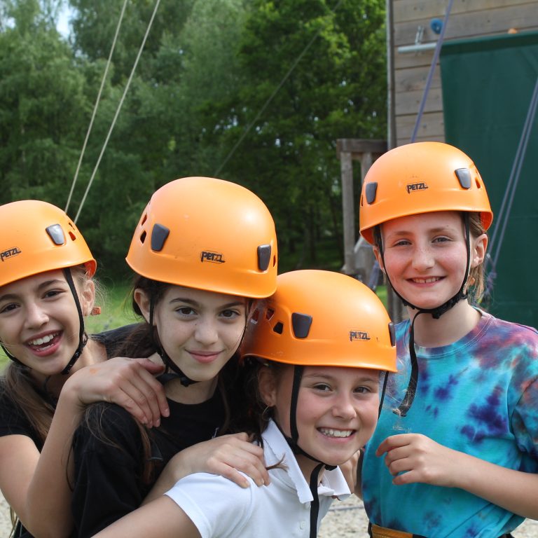 students in rock climbing safety gear